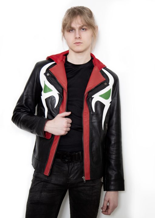 (Front): Photo of a model wearing a black leather jacket. The jacket is a motorcycle cut with a red hood and a red leather lining that is visible inside the cuffs and the folded down collar. There is also a strip of red leather either side of the front zipper. Where breast pockets typically would be on a jacket, there are [handpainted/patched] green eyes surrounded by white details. The collar has metal pop buttons to hold it in place. (Back): Photo of the same black leather jacket with a red hood. The jacket is a motorcycle cut. The inside of the hood has a mesh lining.